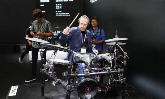 (181010) -- SHANGHAI, Oct. 10, 2018 -- A performer plays the drum-set during the Music China held in east China s Shanghai, Oct. 10, 2018. The 2018 Music China, a musical instrument trade show, opened on Wednesday in Shanghai. Over 2,200 musical instrument companies and dealers from 31 countries and regions participate in the show. ) (sxk) CHINA-SHANGHAI-MUSIC CHINA (CN) FangxZhe 