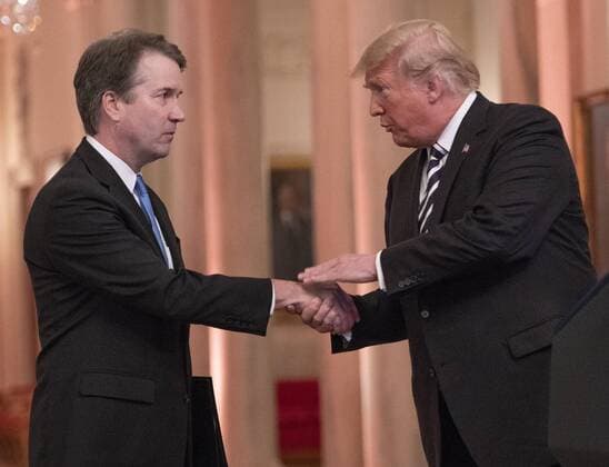 October 8, 2018 - Washington, District of Columbia, U.S. - United States President Donald J. Trump shakes hands with Associate Justice of the US Supreme Court Brett Kavanaugh as he hosts a ceremonial swearing-in ceremony for Kavanaugh in the East Room of the White House in Washington, DC on Monday, October 8, 2018. Kavanaugh formally took the oath on Saturday, hours after he was confirmed by the US Senate. Washington U.S.  - ZUMAc306 20181008_zaa_c306_023 Copyright: xRonxSachsx
