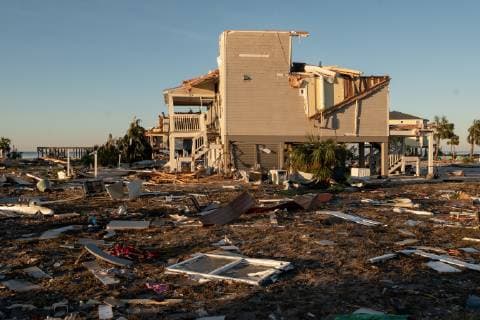 Debris from damaged homes after Hurricane Michael lay strewn about in the early morning in Mexico Beach, Florida October 13, 2018.  WAP20181013506 KENxCEDENO