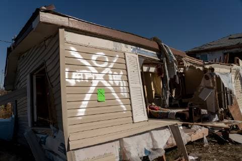 A home is marked that it has been checked for survivors after Hurricane Michael lay strewn about in the early morning in Mexico Beach, Florida October 13, 2018.  WAP20181013522 KENxCEDENO