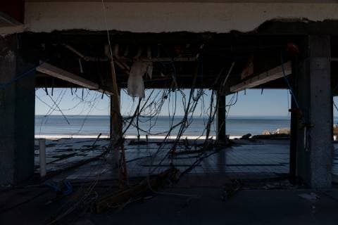 Electrical wires dangle from the ceiling of the parking lot of an apartment building in Mexico Beach, Florida October 13, 2018 following Hurricane Michael.  WAP20181013534 KENxCEDENO