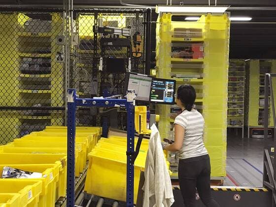 Amazon distribution center Photo taken Sept. 21, 2018, shows a distribution center of Amazon.com Inc. with automated warehouse robots in the suburbs of Seattle, Washington. 