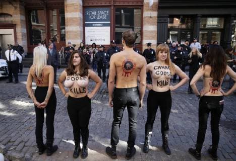 Topless Activists and PETA supporters hold a protest outside of Canada Goose in New York City on October 18, 2018.  NYP20181018101 JOHNxANGELILLO