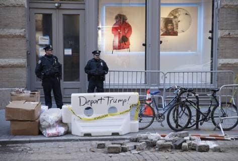 NYPD Police Officers wait for Topless Activists and PETA supporters to arrive before they hold a protest outside of Canada Goose in New York City on October 18, 2018.  NYP20181018111 JOHNxANGELILLO