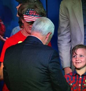 October 26, 2018 - Roswell, NM, U.S. - Zeke Pirtle-7 looks up to Vice President Mike Pence as he greets the supports who sat behind I m as he gave his speech at the Roswell International Air Center as he stumped for Republicans who are running for office in New Mexico. Friday, Oct. 26, 2018. Roswell U.S. - ZUMAab1_ 20181026_zaf_ab1_009 Copyright: xJimxThompsonx