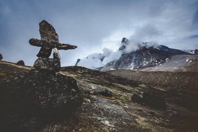 A lone Inuit inukshuk marks the path in Auyuittuq National Park on Baffin Island in the Canadian Arctic., Baffin Island Nunavut Canada Copyright: DavexBroshaxPhotography BRDA000484
