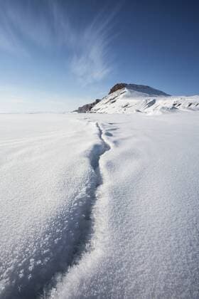 Dramatic split in Arctic Ocean sea ice on the shores of Arctic Bay, Nunavut in the Canadian Arctic., Arctic Bay Nunavut Canada Copyright: DavexBroshaxPhotography BRDA000580