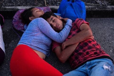 October 29, 2018 - Santiago Niltepec, Oaxaca, Mexico - A couple sleep in the ground as Central American migrants continue their trek toward the US, to the town of Santiago Niltepec in Oaxaca state on Monday. As the number of migrants in the caravan has dropped as people become discouraged or too tired to carry on, President Trump is planning to send 5200 American troops to the border to stop what he calls an Ã¢â‚¬oeinvasion. Santiago Niltepec Mexico - ZUMAl113 20181029_zap_l113_003 Copyright: xMiguelxJuarezxLugox