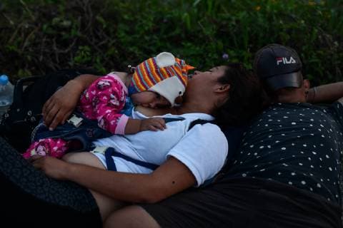 October 29, 2018 - Santiago Niltepec, Oaxaca, Mexico - A couple sleep in the ground as Central American migrants continue their trek toward the US, to the town of Santiago Niltepec in Oaxaca state on Monday. As the number of migrants in the caravan has dropped as people become discouraged or too tired to carry on, President Trump is planning to send 5200 American troops to the border to stop what he calls an Ã¢â‚¬oeinvasion. Santiago Niltepec Mexico - ZUMAl113 20181029_zap_l113_009 Copyright: xMiguelxJuarezxLugox