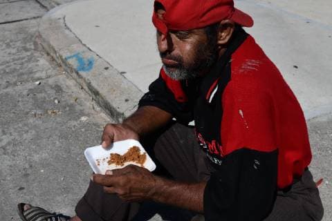 October 29, 2018 - Santiago Niltepec, Oaxaca, Mexico - A man finishes a free meal as Central American migrants line up for a lift as they continue their trek accross Mexico toward the US, Monday to the town of Santiago Niltepec in Oaxaca state on Monday. As the number of migrants in the caravan has dropped as people become discouraged or too tired to carry on, President Trump is planning to send 5200 American troops to the border to stop what he calls an Ã¢â‚¬oeinvasion. Santiago Niltepec Mexico - ZUMAl113 20181029_zap_l113_012 Copyright: xMiguelxJuarezxLugox