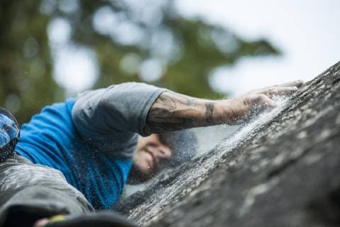 Climber bouldering near Elbow Lake in Fraser Valley, Harrison Mills, British Columbia, Canada, Harrison Mills British Columbia Canada model released Symbolfoto Copyright: ChristopherxKimmel KICH013387