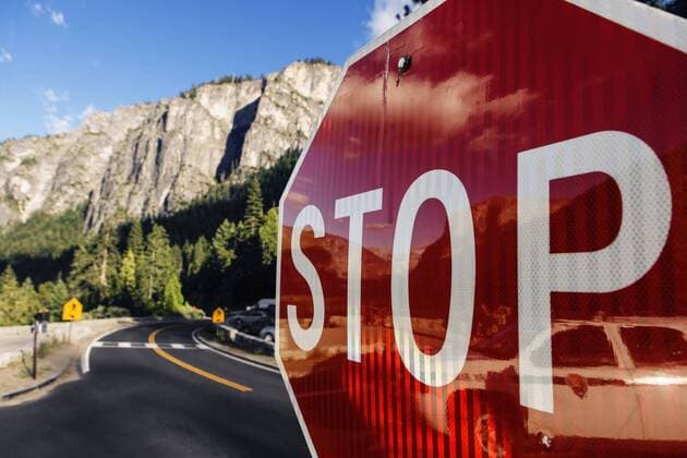Close up of a red stop sign in Yosemite National Park in California, USA., Yosemite National Park CA USA Copyright: RonxKoeberer KORO001047