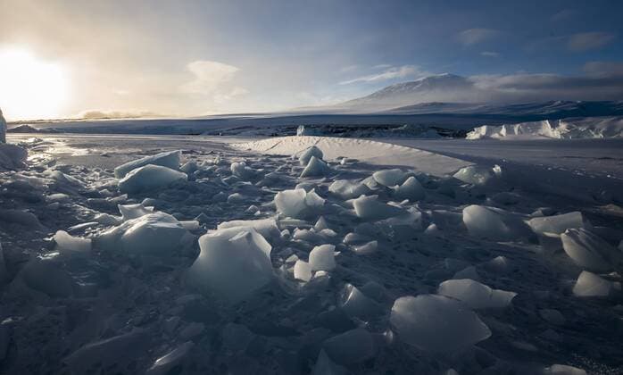 The broken surface of the frozen McMurdo Sound in the Ross Sea region of Antarctica with Mount Erebus in the background., Cape Evans Ross Sea Antarctica Copyright: AlasdairxTurner TUAL000179