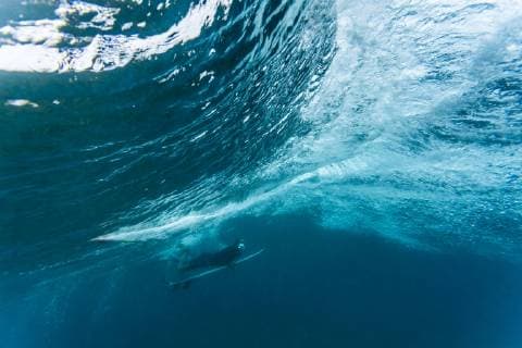 Underwater view of male surfer diving in ocean, Male, Maldives, Male Maldives Maldives TRKO023159 model released Symbolfoto Copyright: KonstantinxTrubavin TRKO023159