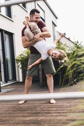 Father and daughter having fun in the garden model released Symbolfoto property released  UUF11826