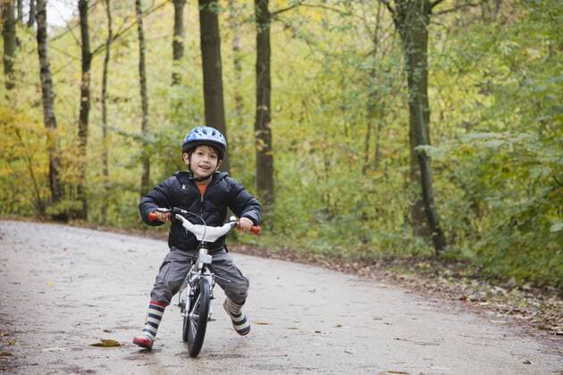 Boy riding bike, smiling at camera  Copyright: FrédéricxCirou B06928026