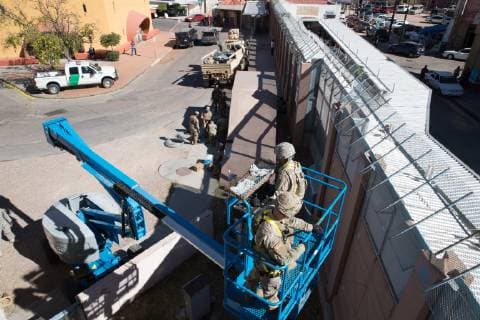 November 7, 2018 - Nogales, AZ, United States of America - U.S. Army soldiers install concertina wire along the Mexico border at the Nogales DeConcini Port November 6, 2018 Nogales, Arizona. The troops are deploying to the U.S. - Mexico border by order of President Donald Trump to intercept the Honduran migrant caravan. Nogales United States of America - ZUMAp138 20181107_zaa_p138_008 Copyright: xJerryxGlaserx