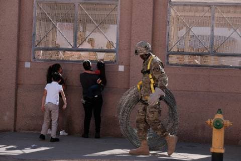 November 7, 2018 - Nogales, Arizona, USA - The US Army laying barbed wire on top of the border wall at international border station in Nogales, Arizona. The soldiers are part of the 5,000 troops that President Trump has ordered the Pentagon to dispatch to the Southwest border to assist the US Border Patrol in advance of the possible arrival of caravans of Central American migrants. Nogales USA - ZUMAb411 20181107_zap_b411_012 Copyright: xChristopherxBrownx