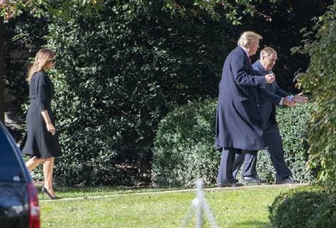 United States President Donald J. Trump and US Senator Lindsey Graham (Republican of South Carolina), followed by First lady Melania Trump, left, are in discussion on the South Lawn of the White House in Washington, DC after their return from the Supreme Court of the US on Thursday, November 8, 2018. Copyright: xx