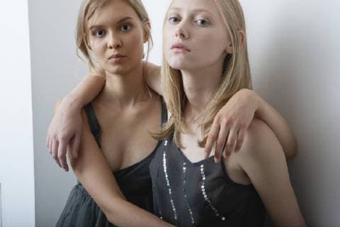 Female friends embracing, portrait  Copyright: AlixxMinde B19450523