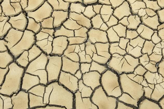 Clay soil burst open by prolonged drought Background image Germany Europe Copyright: imageBROKER/DieterxHopf ibxdeh04770185.jpg