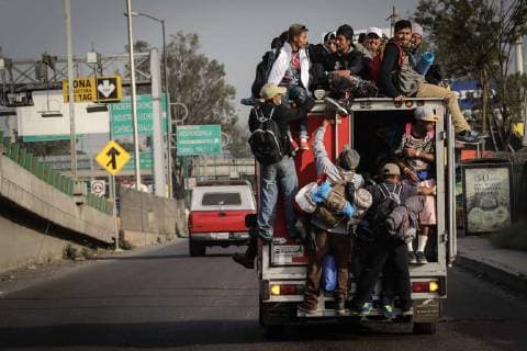 November 10, 2018 - Mexico City, Mexico - People climb onto a truck as the rest of the first contingent of the Migrant Caravan departed from the Jesus Martinez Stadium. They walked through the Peripheral, used public transport and asked for a ride. Mexico  - ZUMAu78_ 20181110_zaf_u78_025 Copyright: xElxUniversalx