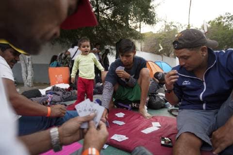 November 15, 2018 - San Diego, California, USA - Men fortunate to get into the temporary shelter set up at the Unidad Deportiva Benito Juarez in Tijuana, pass the time playing cards. San Diego USA - ZUMAs44_ 20181115_zaf_s44_012 Copyright: xNelvinxC.xCepedax