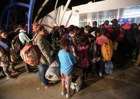 November 15, 2018 - San Diego, California, USA - At the temporary shelter set up at the Unidad Deportiva Benito Juarez in Tijuana, many migrants that arrived on Thursday as part of the central American migrant caravan wait outside hoping to get into the shelter. San Diego USA - ZUMAs44_ 20181115_zaf_s44_017 Copyright: xNelvinxC.xCepedax