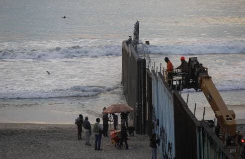 November 15, 2018 - Tijuana, MEXICO - TIJUANA, November 15, 2018 A dolphin, upper left, surfaces as a pod of them swim south past the U.S. border at Playas de Tijuana, Mexico on Thursday. Hayne Palmour IV San Diego Union-Tribune Mandatory Credit: HAYNE PALMOUR IV SAN DIEGO UNION-TRIBUNE ZUMA PRESS San Diego Union-Tribune Hayne Palmour IV copyright 2018 Tijuana MEXICO - ZUMAs44_ 20181115_zaf_s44_030 Copyright: xHaynexPalmourxIvx