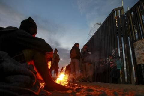 November 15, 2018 - Tijuana, MEXICO - TIJUANA, November 15, 2018 A man burns paper at the U.S. border at Playas de Tijuana, Mexico on Thursday. Hayne Palmour IV San Diego Union-Tribune Mandatory Credit: HAYNE PALMOUR IV SAN DIEGO UNION-TRIBUNE ZUMA PRESS San Diego Union-Tribune Hayne Palmour IV copyright 2018 Tijuana MEXICO - ZUMAs44_ 20181115_zaf_s44_025 Copyright: xHaynexPalmourxIvx