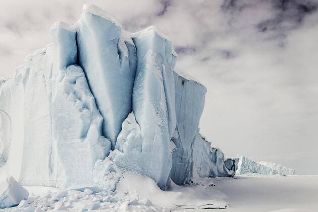 Iceberg seen from frozen fjord Baffin Island Davis Straight Coast Nunavut Canada North America Copyright: imageBROKER/RussellxMillner iblrmi04782903.jpg