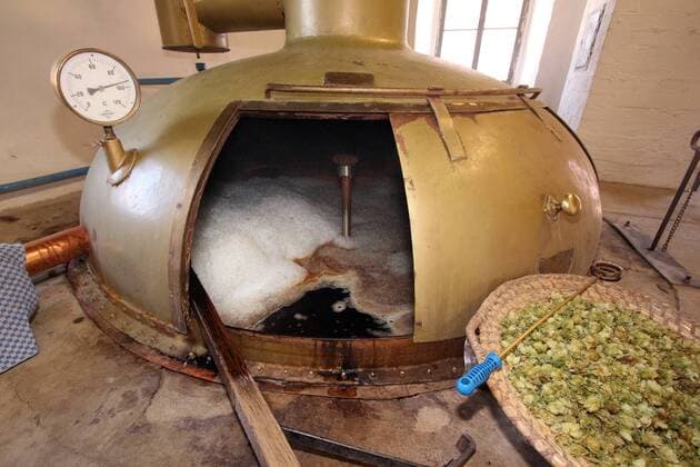 Brewing kettle with mash and hops in a historical brewery in the Franconian open-air museum in Bad Windsheim Middle Franconia Franconia Bavaria Germany