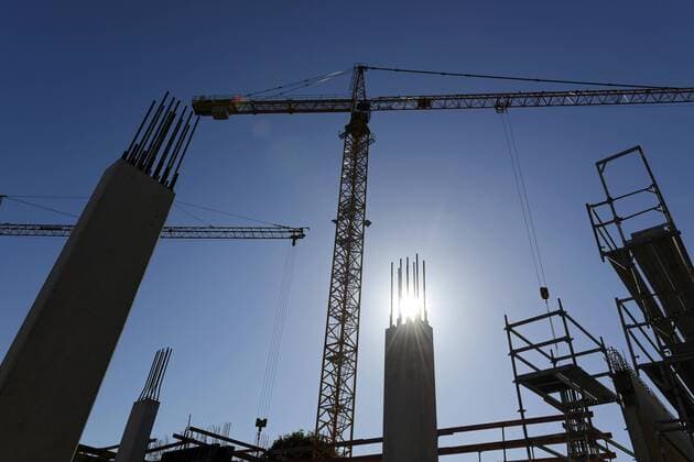 Germany, Bavaria, Geretsried, construction site, crane against the sun  LHF00585