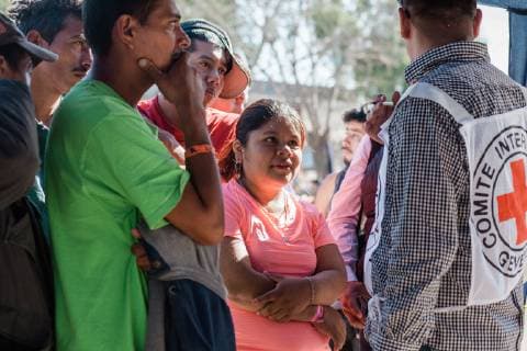 People wait in line at the ICRC tent, set up to assist migrants in contacting their families, in front of the Benito Suarez shelter on November 27, 2018 in Tijuana, Mexico. Migrants, refugees and asylum seekers are congregating south of the U.S. border  TIJ2018112711 ARIANAxDREHSLER