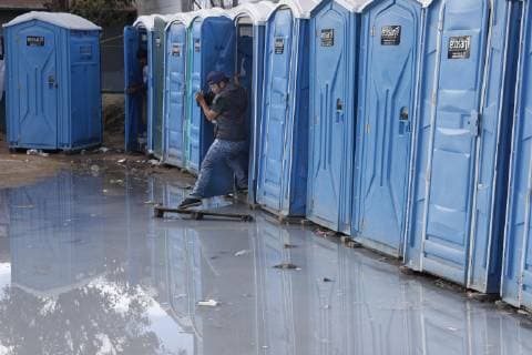 Migrant caravan A migrant from Central America is pictured at a toilet facility in Tijuana, Mexico, on Nov. 28, 2018. 