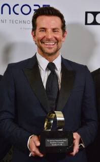 Actor Bradley Cooper holds the American Cinematheque Award during a photo-op at the entertainment industries annual gala at the Beverly Hilton Hotel in Beverly Hills, California on November 29, 2018. Bradley was honored as an extraordinary artist in the entertainment industry currently making a significant contribution to the art of the moving picture.  LAP2018112912 JIMxRUYMEN