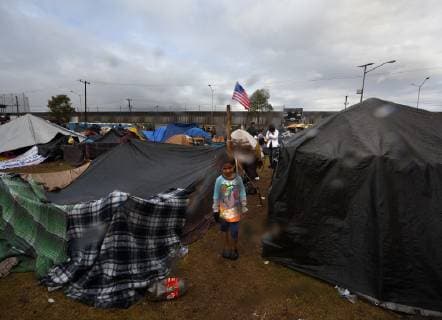 November 29, 2018 - Tijuana, Mexico - People navigate severe flooding at the migrant caravan camp Centro Deportivo Benito Juarez on November 29, 2018. It is being called a humanitarian crisis. We lost everything, said a migrant walking through debris. Many migrants appeared to realize that the hope they held to begin a new life in America had dimmed and their stay in Mexico may be longer than anticipated. Tijuana Mexico - ZUMAg208 20181129_zap_g208_007 Copyright: xCarolxGuzyx