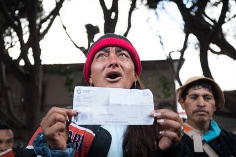 December 1, 2018 - Tijuana, Mexico - MIGRANTS MOVING SHELTER IN TIJUANA. Mexican officials move the migrants from Honduras from shelter close to the boarder to shelter furtherer away. Scenes of ghost town inside original shelter. Women speaks to crowd about seeking asylum in the USA Tijuana Mexico - ZUMAc109 20181201_zap_c109_005 Copyright: xRachelxCerettox