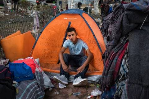December 1, 2018 - Tijuana, Mexico - MIGRANTS MOVING SHELTER IN TIJUANA. Mexican officials move the migrants from Honduras from shelter close to the boarder to shelter furtherer away. Scenes of ghost town inside original shelter. Oscar Canizales 20 in front of his temporary shelter. Tijuana Mexico - ZUMAc109 20181201_zap_c109_014 Copyright: xRachelxCerettox