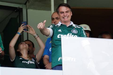 The elected president of Brazil, Jair Bolsonaro, wearing the Palmeiras Club shirt, greets supporters before the start of the match between Palmeiras and Vitoria for the Brazilian soccer championship, at the Allianz Parque stadium in Sao Paulo, Brazil, 02 December 2018. Palmeiras was proclaimed last Sunday, November 25, the Brazilian league champion for the tenth time and got it one date before the end of the tournament after beating Vasco da Gama at home by 1-0. Bolsonaro will assume the Brazilian Presidency next 01 January. Bolsonaro attends the match of the proclaimed champion of the Brazilian League, Palmeiras, against Vitória in Sao Paulo !ACHTUNG: NUR REDAKTIONELLE NUTZUNG!  Copyright: xSebastiaoxMoreirax AME4420 20181202-636793808615753798