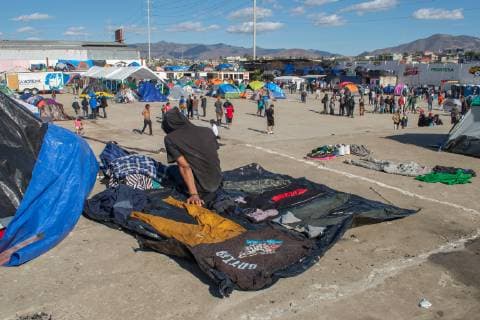 December 2, 2018 - Aslyum seeker from the Migrant Caravan dries clothes on top of a roof in El Barretal, the new shelter in Tijuana,Mexico on December 2, 2018. El Barretal, located a few miles from the border, has been designated as the shelter for the Central Americans. The number of migrants is over 1,000 and rising at the camp. - ZUMAs157 20181202_znp_s157_002 Copyright: xVitoxDixStefanox