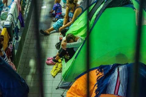 December 2, 2018 - Aslyum seekers from the Migrant Caravan settle into El Barretal, the new makeshift shelter in Tijuana,Mexico on December 2, 2018. Children and families are allowed to stay inside the main building on site. El Barretal, is a dancel hall event space and located a few miles from the border, has been designated as the shelter for the Central Americans. The number of migrants is over 1,000 and rising at the camp. - ZUMAs157 20181202_znp_s157_006 Copyright: xVitoxDixStefanox