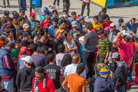 December 2, 2018 - Aslyum seekers from the Migrant Caravan listen to a representive from El Otro Lado, a bi-national, direct legal services organization serving indigent deportees, migrants, and refugees in El Barretal, the new makeshift shelter in Tijuana,Mexico on December 2, 2018. The presentation was giving an outline on how to properly seek aslyum. - ZUMAs157 20181202_znp_s157_012 Copyright: xVitoxDixStefanox