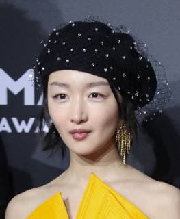Chinese actress Zhou Dongyu poses as she arrives for the 15th Esquire Men At His Best (MAHB) Award 2018 in Beijing, China, 4 December 2018. Ghost horse spirit Zhou Dongyu looks cute at 2018 Esquire Men At His Best Award in Beijing  scr154372