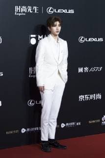 Singer and rapper Cai Xukun of Chinese boy group Nine Percent poses as he arrives for the 15th Esquire Men At His Best (MAHB) Award 2018 in Beijing, China, 4 December 2018. Cai Xukun dressed in white suit to glam up 2018 Esquire Men At His Best Award in Beijing  bjl363677