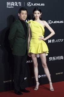 Chinese model Xi Mengyao, also known as Ming Xi, poses as she arrives for the 15th Esquire Men At His Best (MAHB) Award 2018 in Beijing, China, 4 December 2018. Ming Xi flashes sexy long legs at 2018 Esquire Men At His Best Award in Beijing 