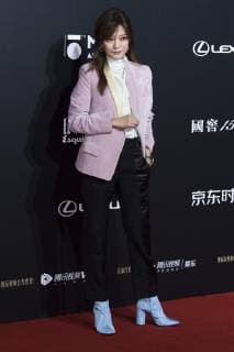 Chinese actress Zhao Wei poses as she arrives for the 15th Esquire Men At His Best (MAHB) Award 2018 in Beijing, China, 4 December 2018. Zhao Wei shows off femininity in pink suit at 2018 Esquire Men At His Best Award in Beijing  bjl363618