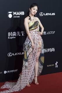 Chinese actress Yang Mi poses as she arrives for the 15th Esquire Men At His Best (MAHB) Award 2018 in Beijing, China, 4 December 2018. Yang Mi flaunts sexy see-through and strapless dress at 2018 Esquire Men At His Best Award in Beijing  bjl363620