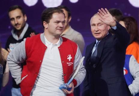 MOSCOW, RUSSIA - DECEMBER 5, 2018: Dobrovolets Rossii prize winnter Anton Korotchenko from Smolensk Region (L front) and the President of Russia Vladimir Putin (R) at the 2018 Dobrovolets Rossii (Volunteer of Russia) award ceremony at CSKA Arena on International Volunteer Day; the event is part of the 2018 International Volunteer Forum. Mikhail Metzel TASS  TS099E0C