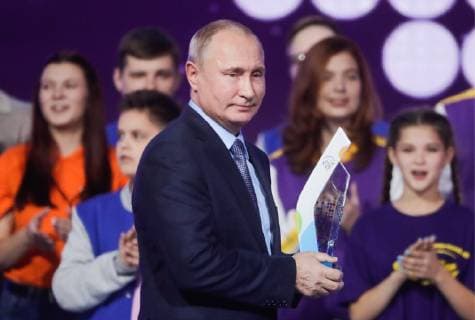 MOSCOW, RUSSIA - DECEMBER 5, 2018: The President of Russia Vladimir Putin (front) and Dobrovolets Rossii prize winners at the 2018 Dobrovolets Rossii (Volunteer of Russia) award ceremony at CSKA Arena on International Volunteer Day; the event is part of the 2018 International Volunteer Forum. Mikhail Metzel TASS  TS099E3A